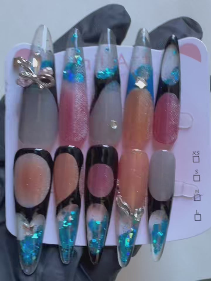 Load video: Candy Pudding Hand Drawn Cat Eye Blue Sequin Flowing Sand Nail Art